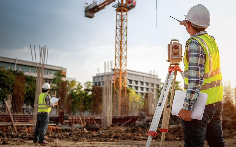 Two Worker Examine the Construction site