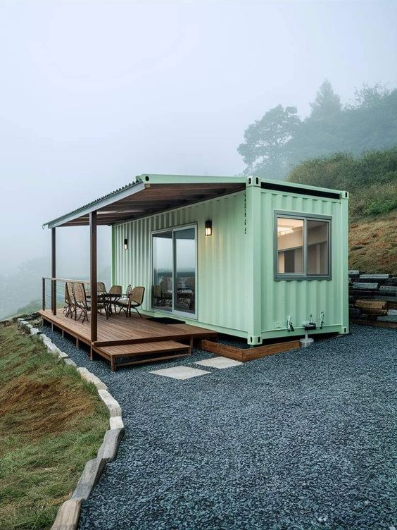 Modern shipping container home with a porch