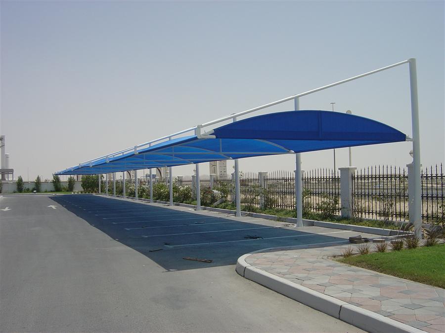 Blue tensile fabric car parking shed.