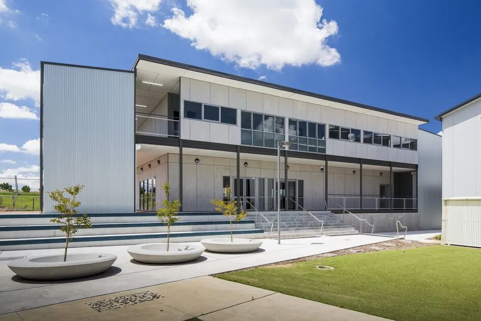 Modern school building with clear blue sky