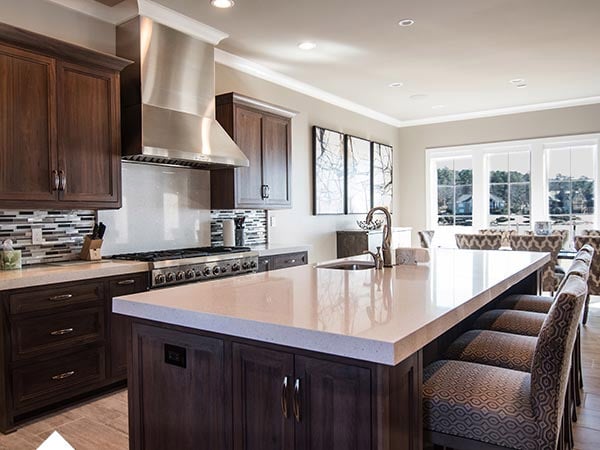 Elegant kitchen with natural light and stylish decor.